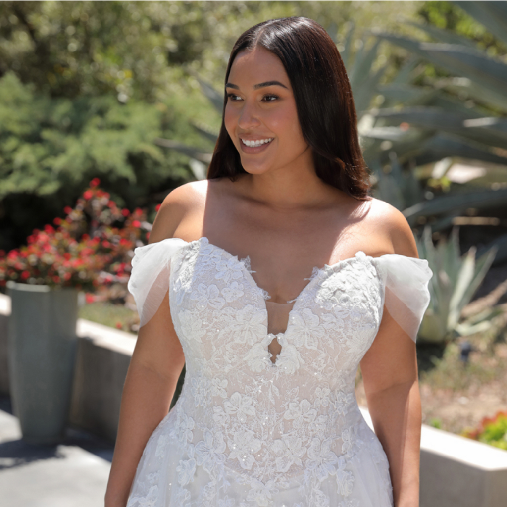 An ethereal, romantic gown with a sparkling illusion lace bodice leading to  a light, soft A-line tulle and chiffon skirt featuring a high