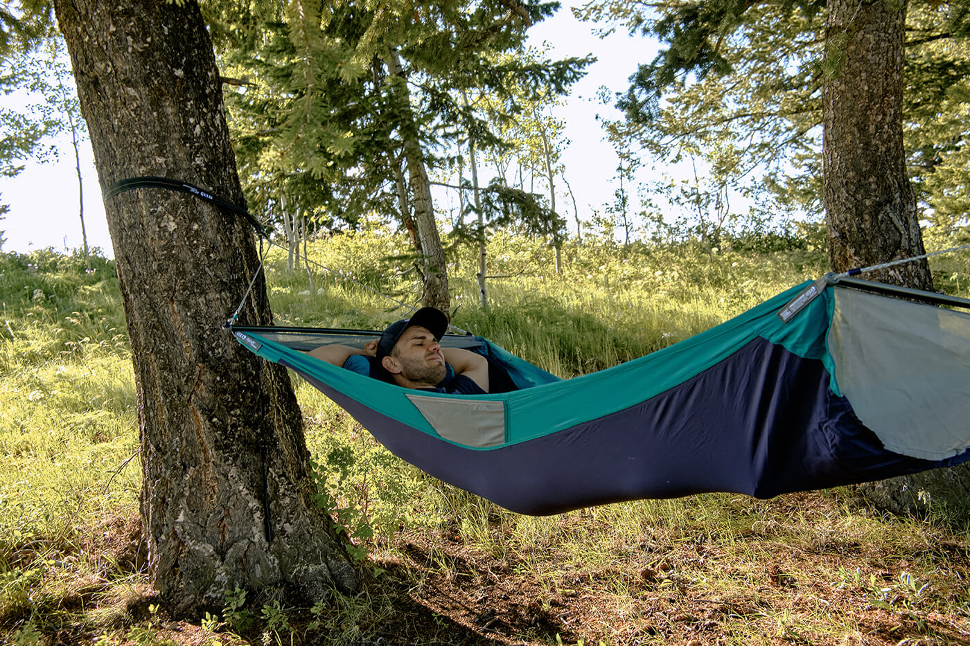 A man rests in his SkyLoft Hammock