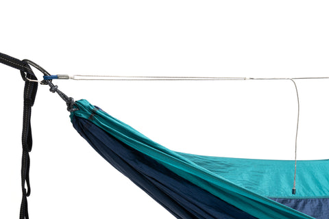 A studio image of an ENO hammock with the Microtune attached to the carabiner. 