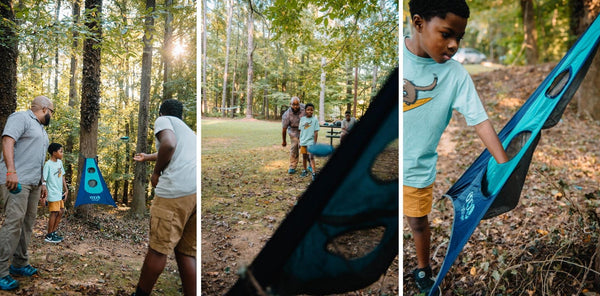 A family playing with ENO's Trailflyer game