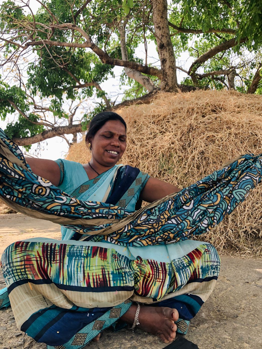 woman unfolding a roots studio ENO doublenest hammock print