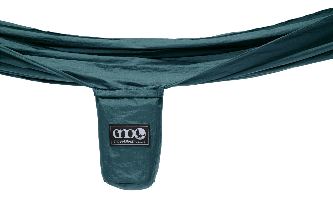 sideway view of an ENO TravelNest hammock stuff sack with hammock expanded