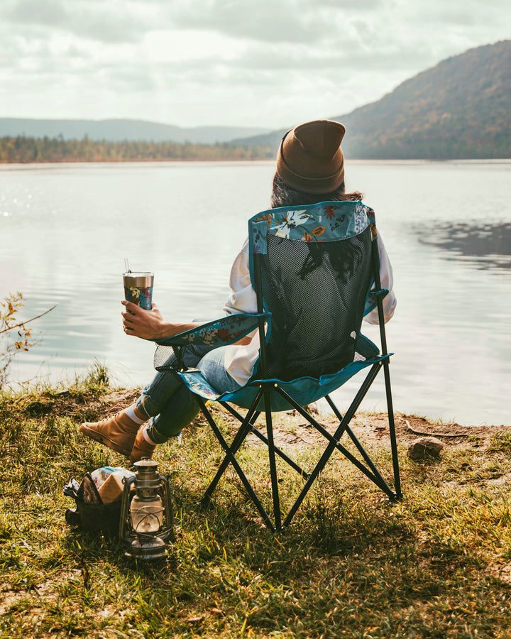 Girl sitting in camping chair