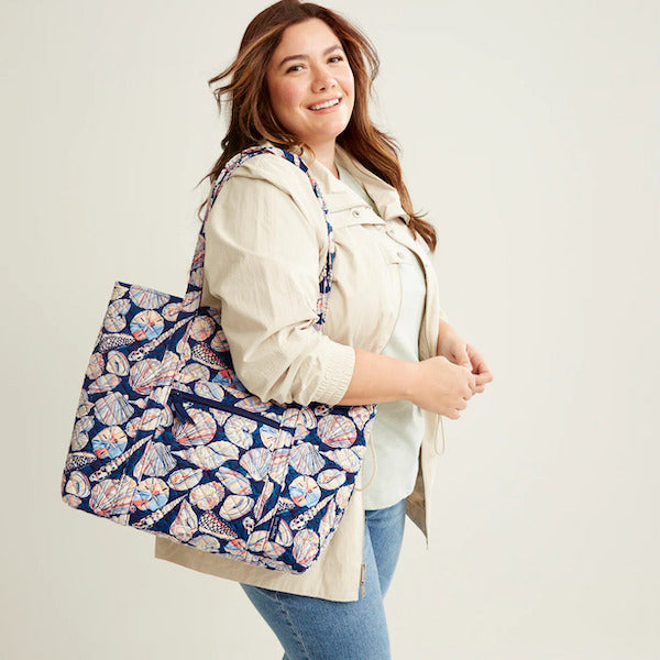 Model carrying Vera Bradley tote bag