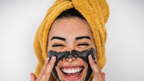 woman with charcoal mask