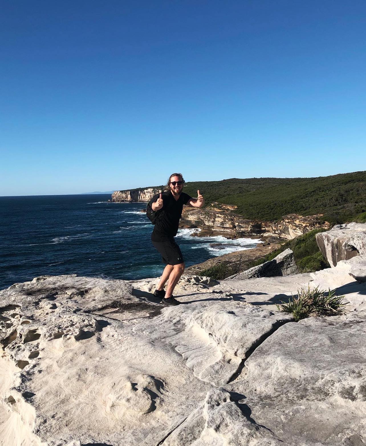 Rowan Smith wearing Ottie Merino Men's Short Sleeve T-Shirt in Black