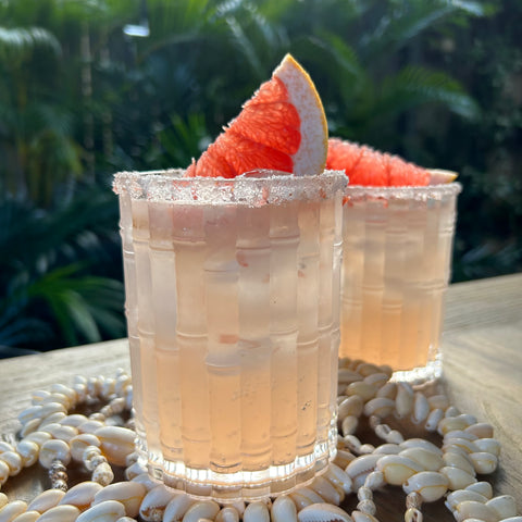 Crisp, refreshing cocktail of tequila and pink grapefruit juice at sunset.