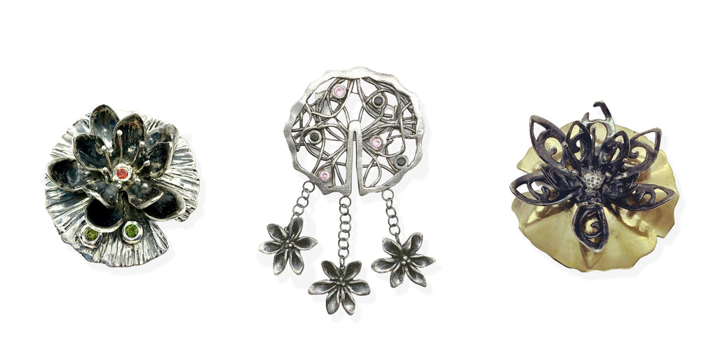 Left: Waterlily #1 (Everyday Armour collection), 2020. Sterling silver, cubic zirconia. 5.5 x 5.5 x 2.5 cm. Centre: Waterlily #3 (Everyday Armour collection), 2020. Sterling silver, cubic zirconia. 7.0 x 10.0 x 1.5 cm. Right: Waterlily #2 (Everyday Armour collection), 2020. Sterling silver, bronze. 7.5 x 7.5 x 2.5 cm.