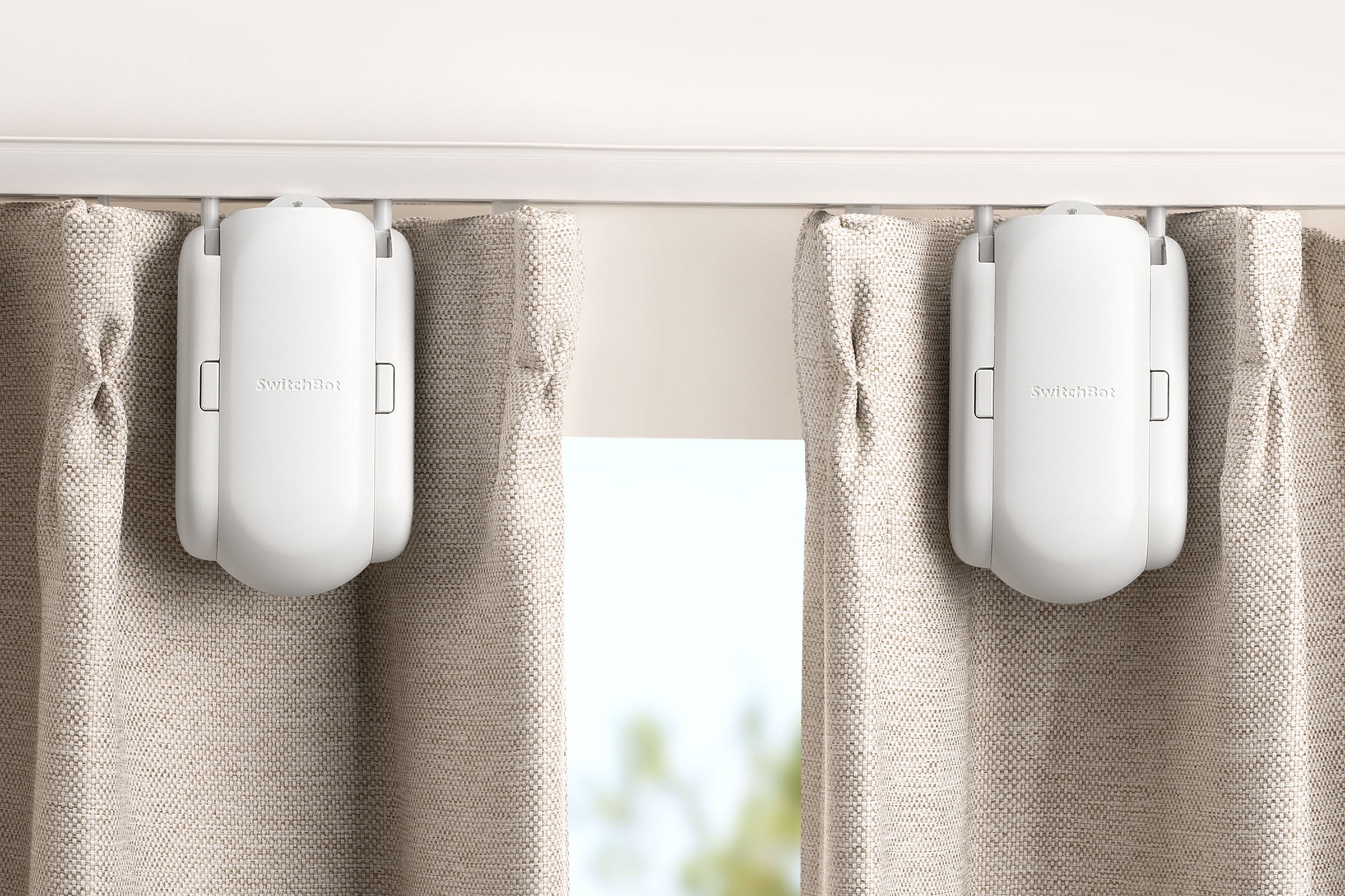 You can get SwitchBot Curtain Starter Pack (two units) so to open and close your double-sided curtains from the middle. By just a simple setup in the App, two curtains will run as one on the track. 