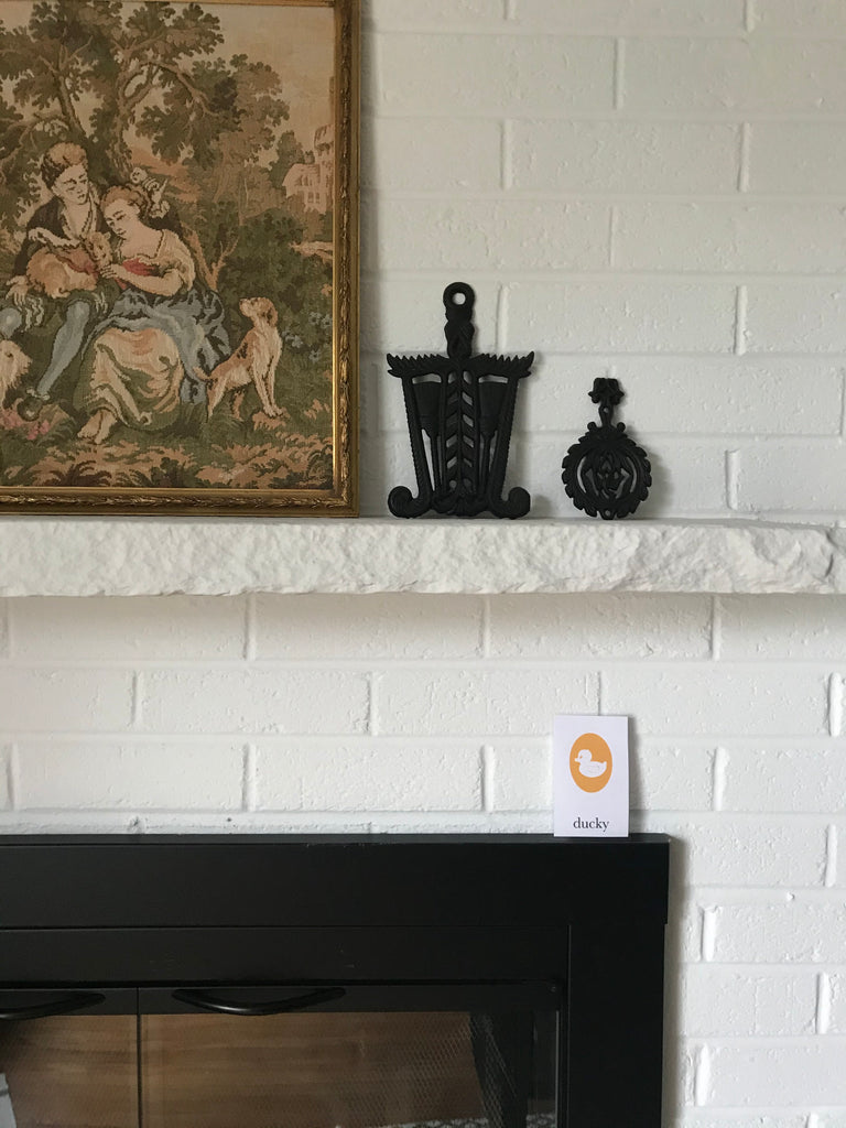 rubber ducky cameo flashcard hiding on fireplace