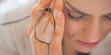 woman with hands on face