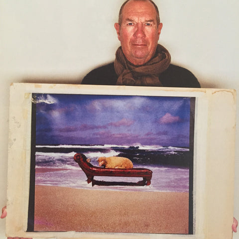 Aubrey Powell with the original artwork for 10cc Look Here album cover