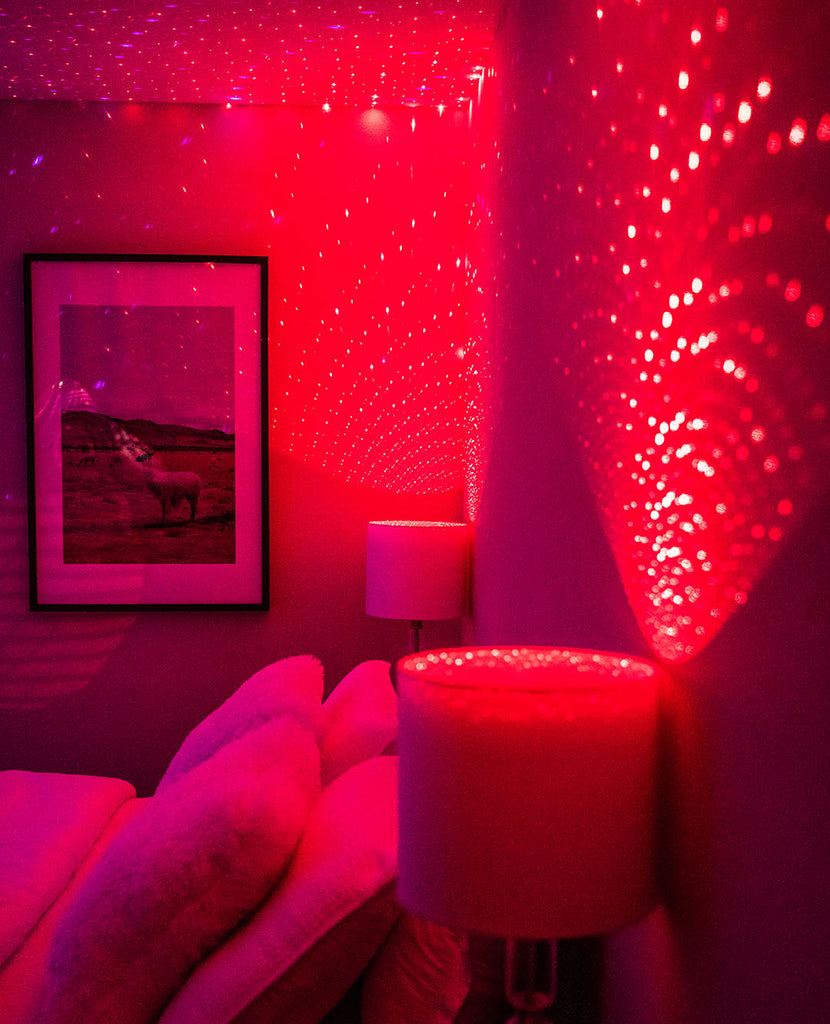 room with red blissbulbs starry lights