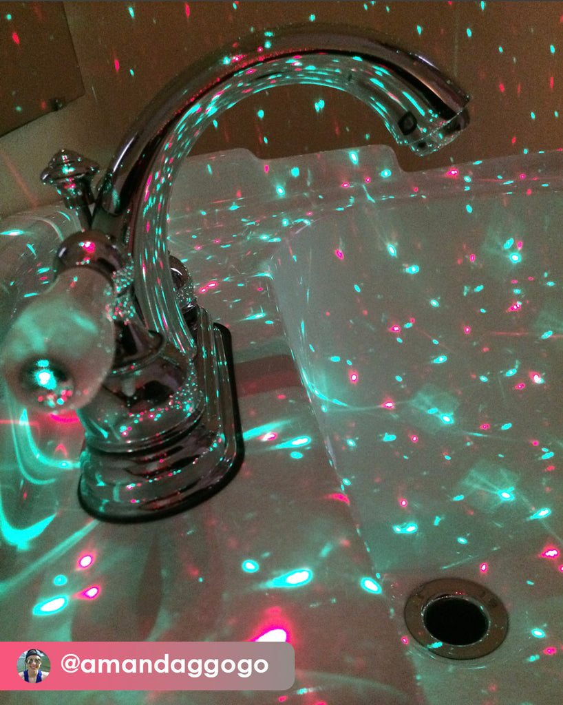 red and green laser bulbs in bathroom photographed by instragram user @amandaggogo