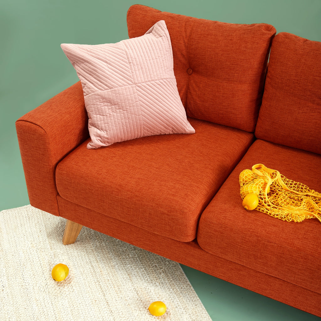 orange reupholstered sofa