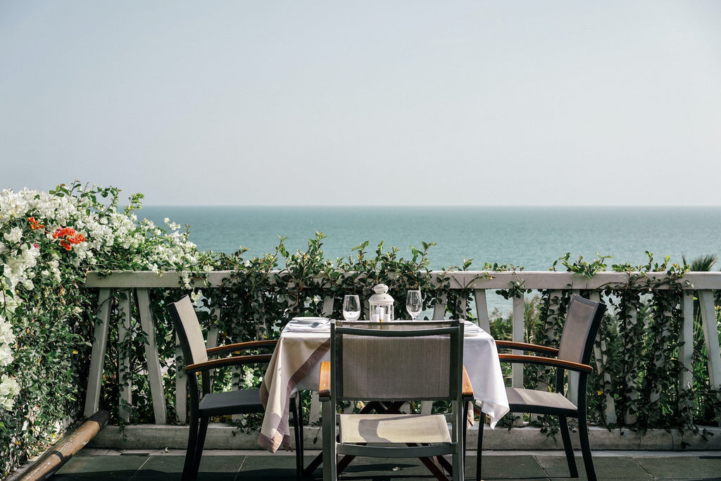 balcony with chairs and tabl