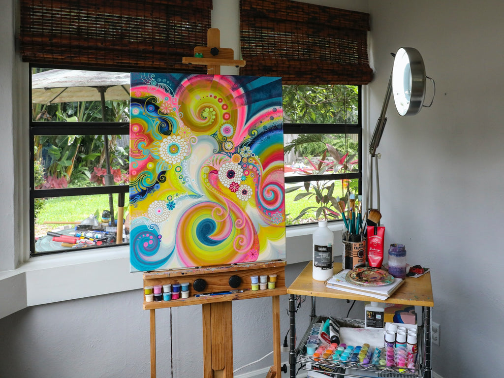 craft room with easel and painting