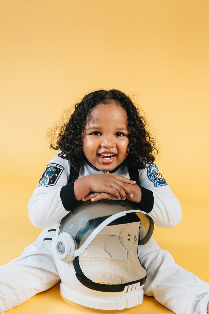 little girl dressed in astronaut costume