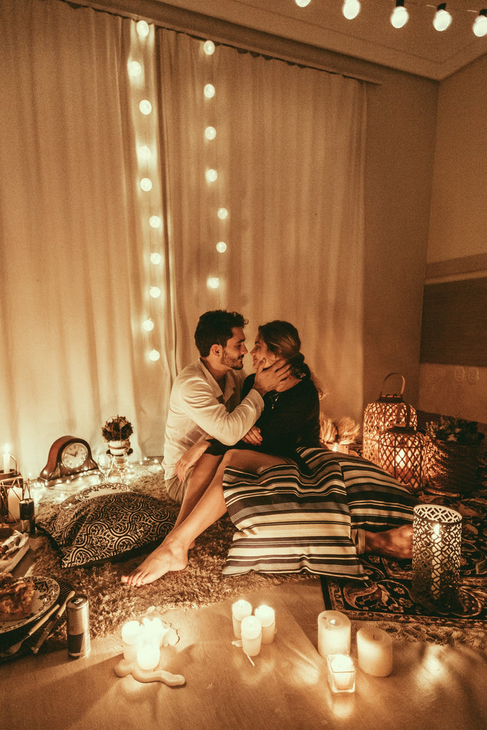 couple surrounded by romantic candles