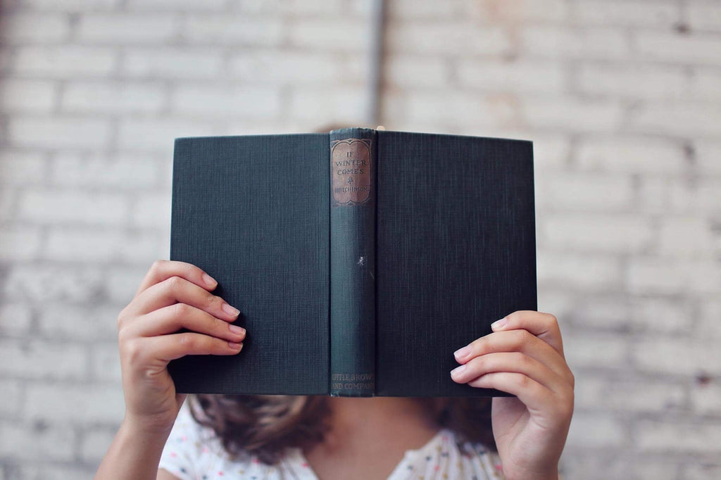 woman posing with book