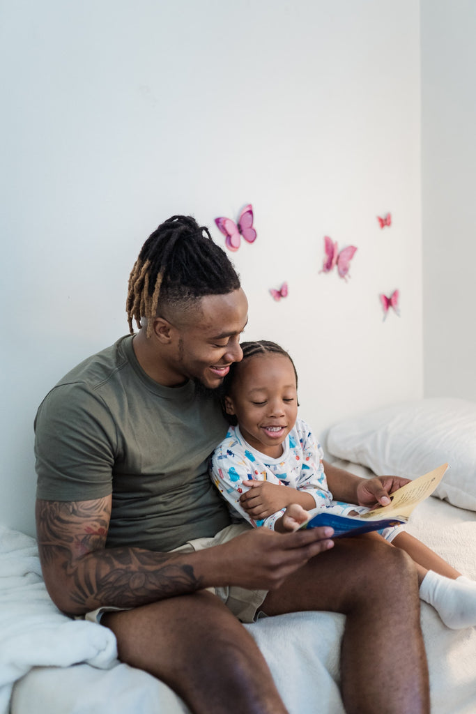 dad and child reading a book