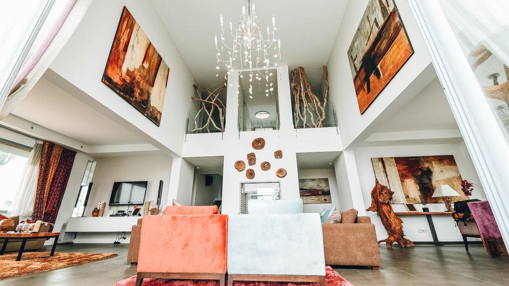 tall room with art and chandelier