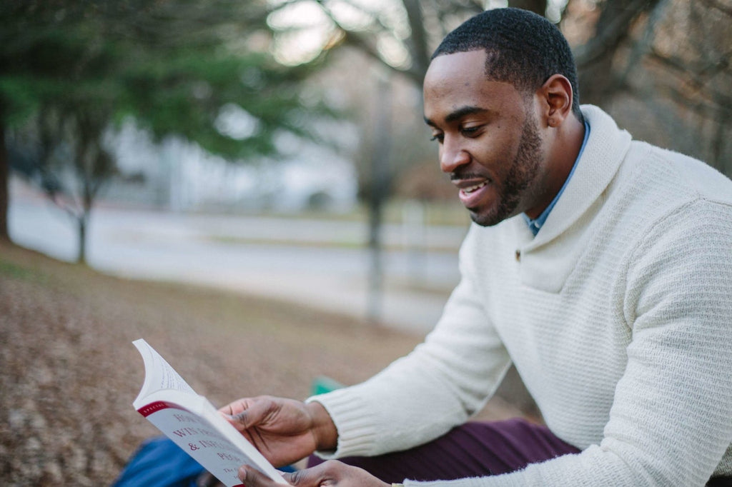 man reading book