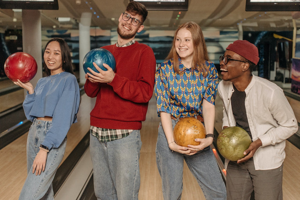 two couples at a bowling alley