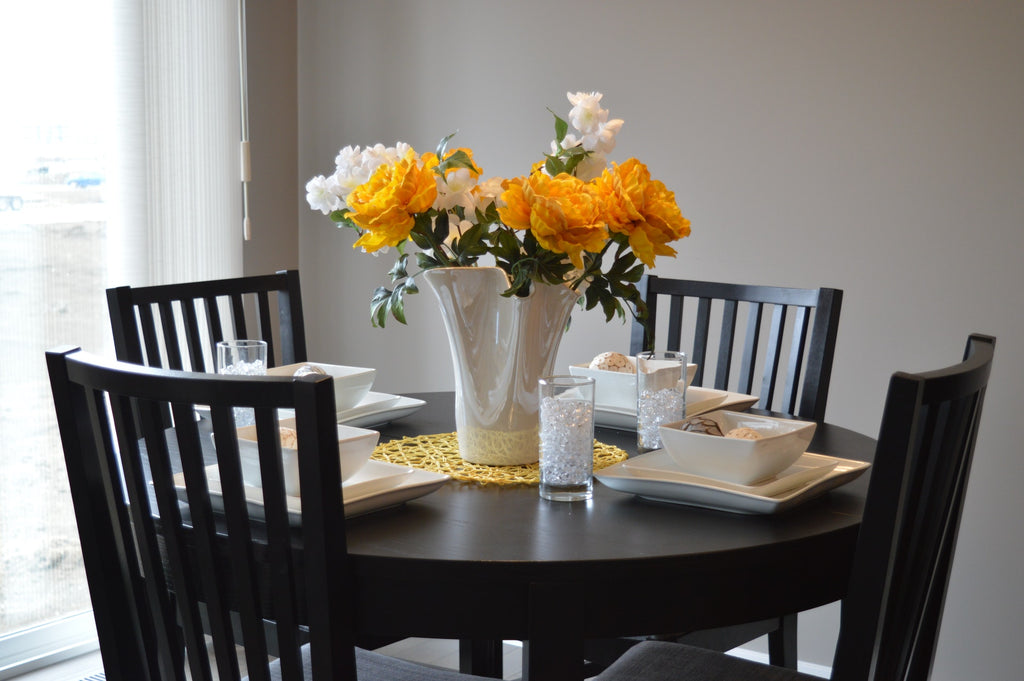 modern dining table with yellow flowers