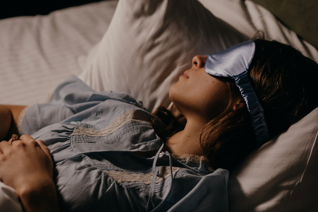 woman wearing silk eye mask