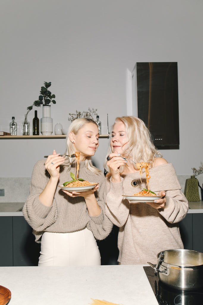 mom and daughter cooking