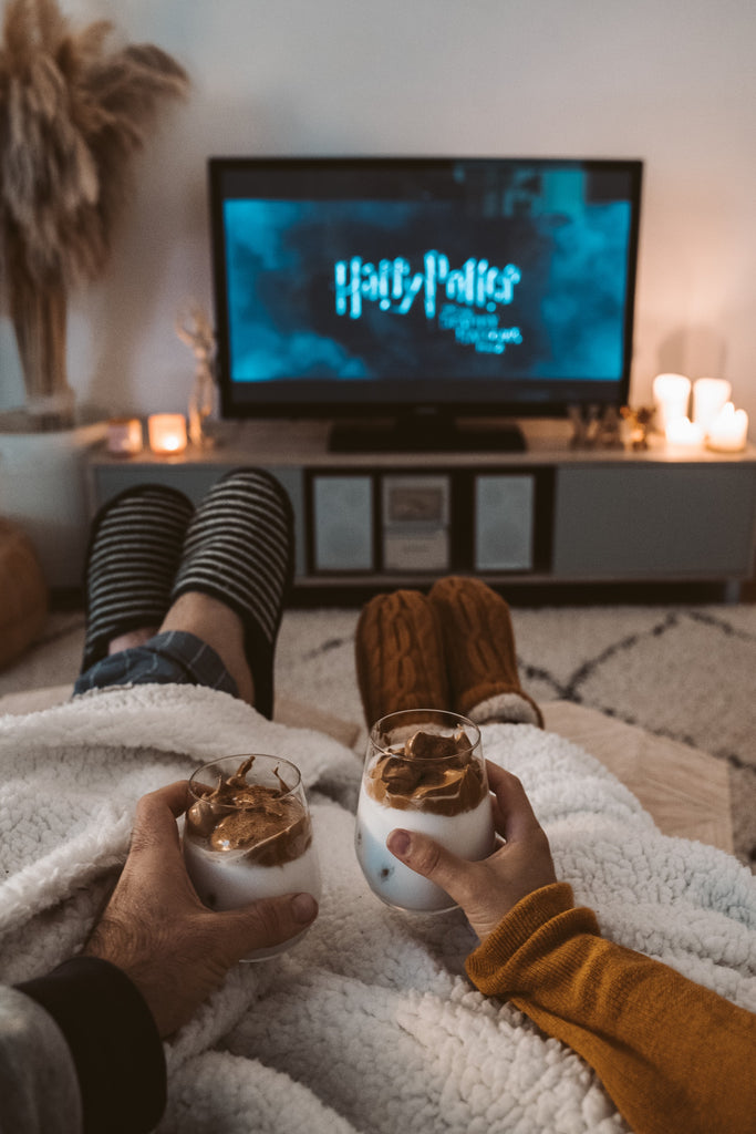 couple watching harry potter movie marathon night