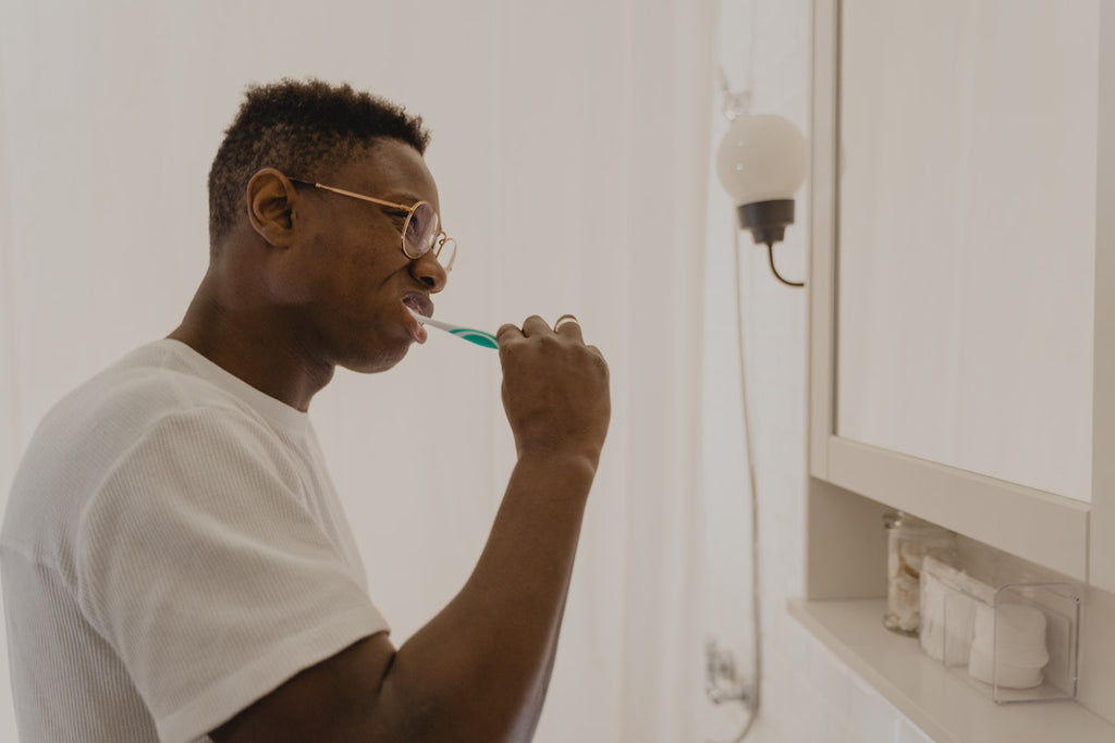 man brushing teeth