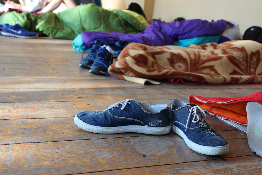 shoes and colorful sleeping bags