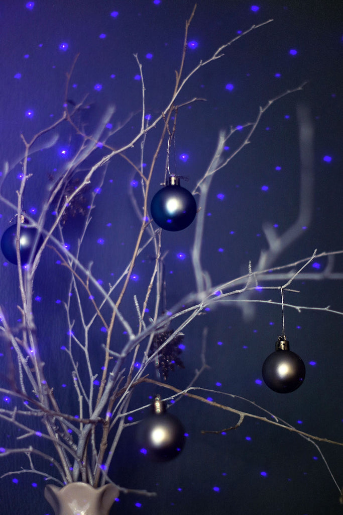 winter themed ornaments with blue laser lights