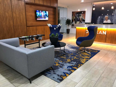 contemporary reception office with center table and rug