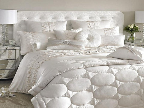 white bed sheet and duvet