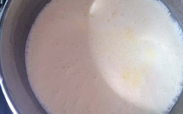 Place milk and cream in a 2-quart pot on medium heat and cook till milk/cream mixture just comes to a simmer.