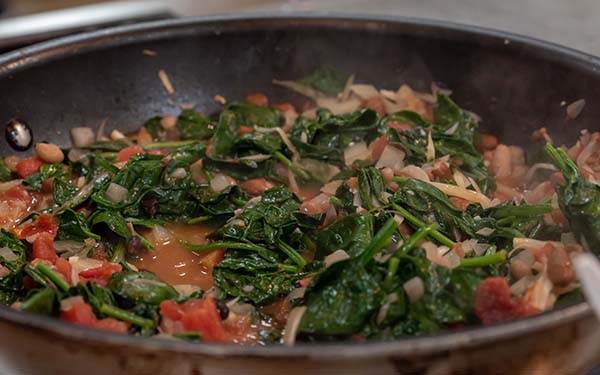 Cook until the spinach is wilted and the beans are just heated through, about 3 minutes. 