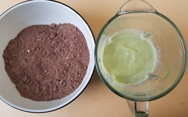 For the cake: In a large mixing bowl, combine all the dry ingredients thoroughly and set aside. In a blender or food processor blend all the wet ingredients until a smooth batter forms with no lumps of avocado. 