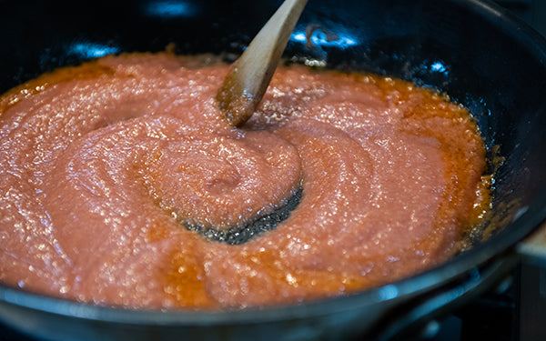 Add remaining 1 T oil to the same pan and place over medium high heat. When hot, add the tomato mixture from the blender. Reduce heat to simmer when it starts to thicken.