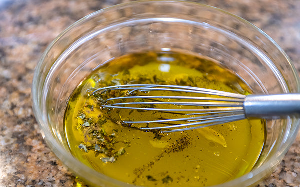 Combine the dressing ingredients together until the dressing is emulsified, and set aside.