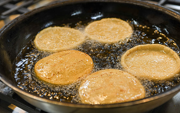 To prepare the sopes, swirl some oil in a sauté pan over medium-high heat.