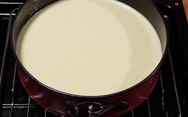 In a large mixing bowl beat cream cheese until light and fluffy, then add eggs one by one, scraping down the sides between each and mix until all three have been combined.