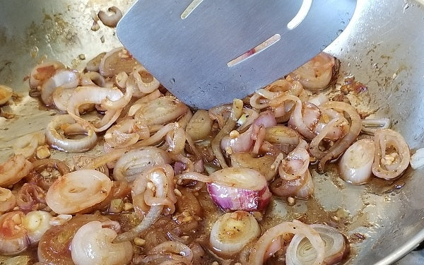 Add a few drops of oil into the same pan to sauté shallots until soft. Blend in the garlic and chili garlic sauce and continue the sauté until the garlic is fragrant. 