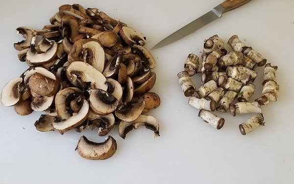 Remove stems and slice mushrooms thin. Retain stems for another dish. 