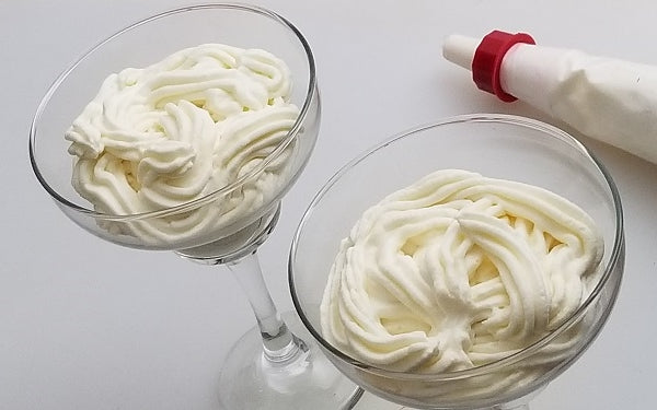 Pipe mascarpone mixture into 2 large margarita glasses. Top with the roasted berries and serve.