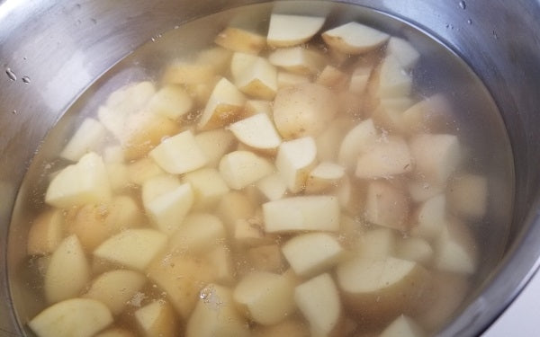 Place potatoes in a small saucepan and cover with cold water by 1-inch. Add 1 tablespoon salt and the vinegar. 