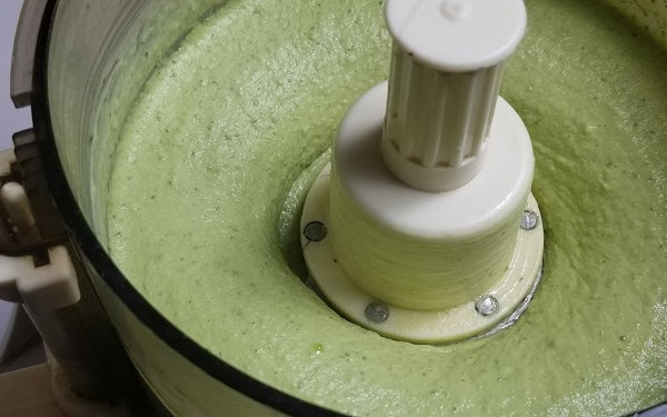 Transfer avocado slices from freezer to food processor. Cover with the cilantro and the juice from the zested limes.