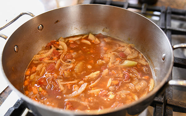 Add warm stock and simmer for 5 – 10 minutes. Season to taste with salt and pepper.